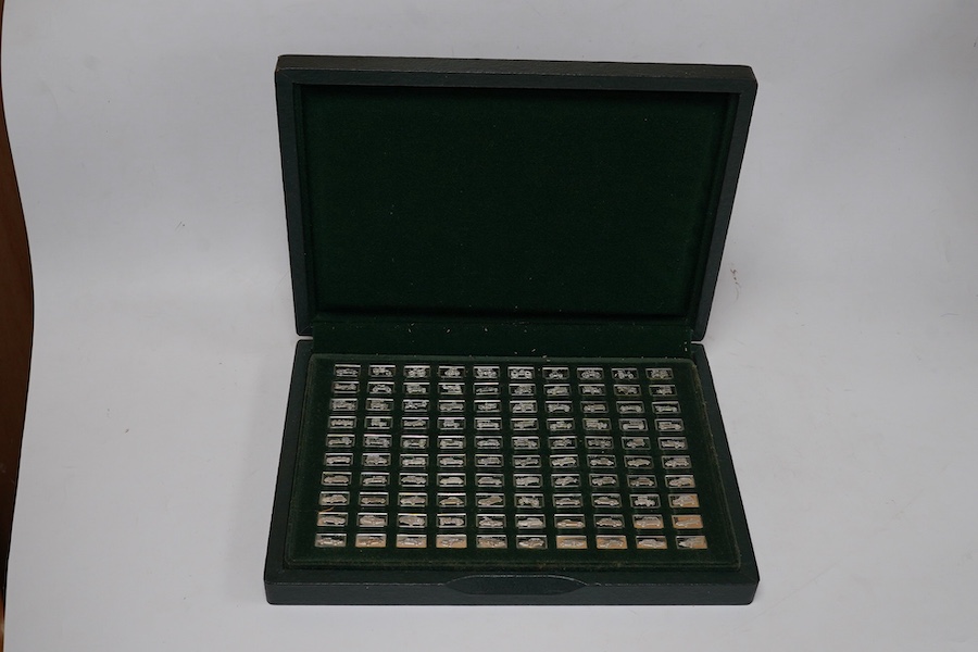 A cased set of one hundred 925 ingots, each depicting a different car model, each 27mm and weighing approximately 1.6 grams. Condition - good